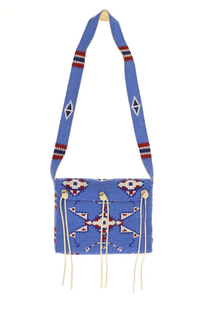 Arapaho Fully Beaded Purse w/ Elk Teeth 20th-Cent.: The lot features a beautiful full beaded Arapaho Elk Indian Hide purse with Elk Teeth accents from the 20th-Century. The bag shows Indian tanned Rocky Mountain Elk hide construction with sinew and thr
