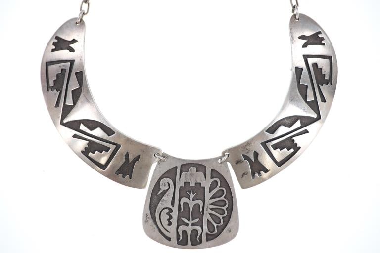 ca. 1950 Old Hopi Sterling Overlay Choker Necklace: Featured in this lot is this Old Hopi Sterling Silver Overlay Gorget Choker Necklace, circa 1950s to 1960s, signed. The centre pendant displays the corn symbol between the two halves of a water bird.