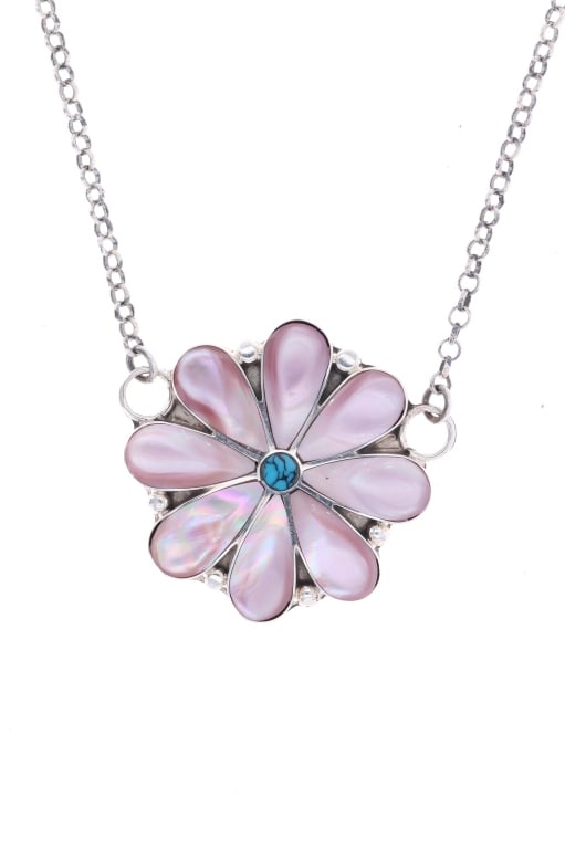 Zuni A. Ahijito Pink Mother of Pearl Necklace: Featured in this lot is this sterling silver and Pink Mother of Pearl necklace from Zuni artist A. Ahijito. The necklace features a wonderfully and professionally crafted sterling silver and pink moth