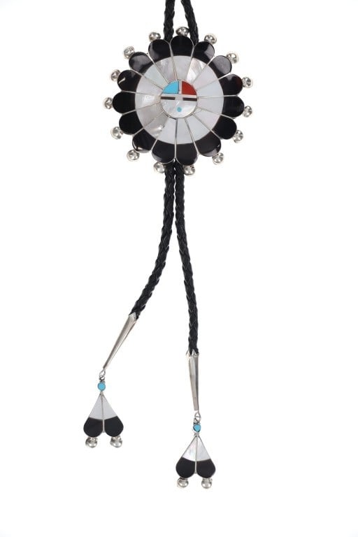 Zuni Pauline Lonjose Sterling Inlay Sunface Bolo: The lot features a fantastic Zuni Pauline Lonjose large multistone inlay Sunface Bolo Tie, with a vintage age. The piece is signed, P. Lonjose Zuni S/S on the back by Zuni artist Pauline Lonjose showi