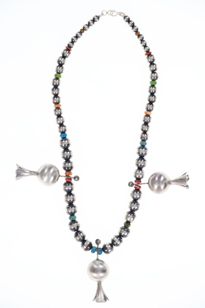 Navajo Sterling Silver Pearl Blossom Necklace: Featured in this lot is this Navajo sterling silver pearl and blossom necklace. The necklace features a wonderfully and professionally crafted sterling silver and multistone construction that shows a 