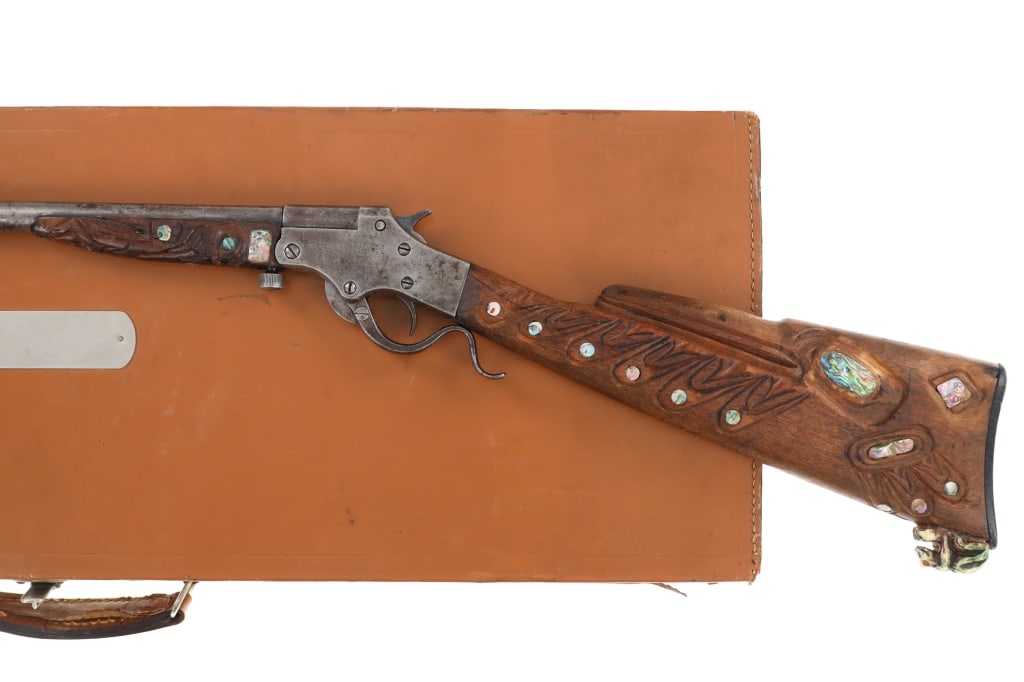 Exceptional Haida Indian Carved Cased Stevens .44: The lot features an exceptional Haida Northwest Coast Indian Raven totem carved Stevens Arms and Tool Co. Special Ordered One of One Tip-Up Break-Down .44 Cal Smokeless Rifle / Shotgun in a custom lea