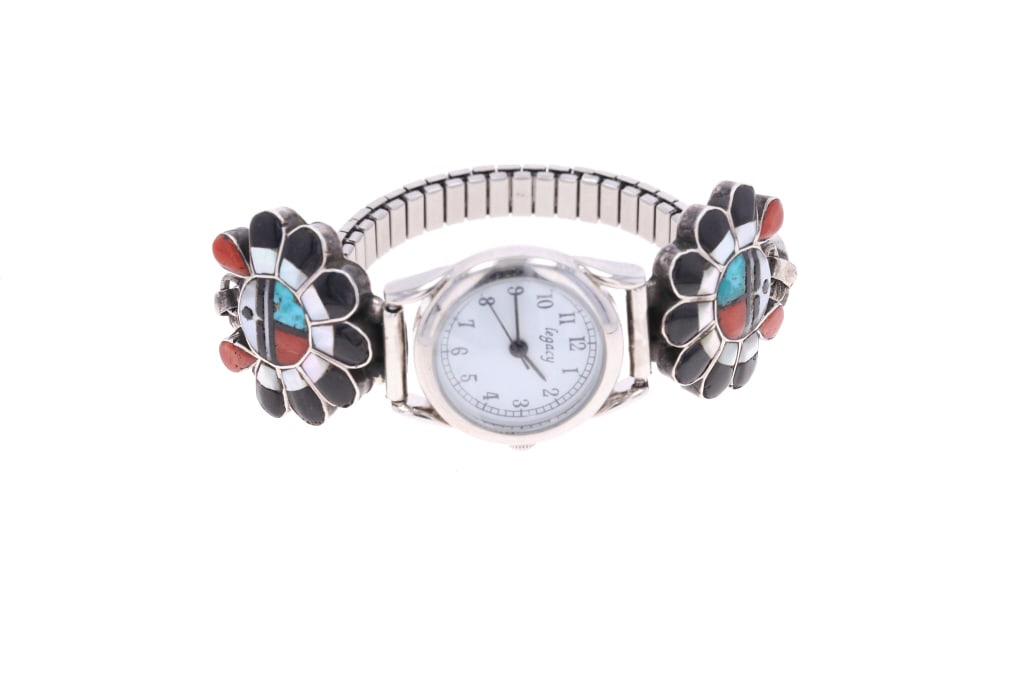 Pueblo Zuni Sterling Inlaid Sunface Watchband: Featured in this lot is this Pueblo Zuni sterling silver inlaid Sunface watchband. The watchband features a wonderfully and professionally crafted sterling silver and stainless steel construction