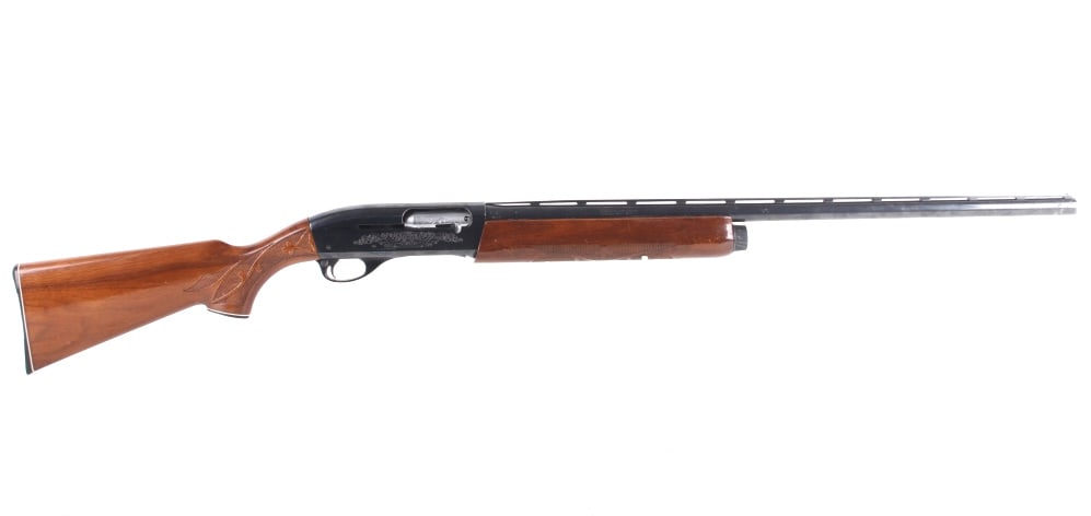 Remington Model 1100 12 GA Engraved Shotgun: Featured in this lot we have a factory engraved Remington Model 1100 12 Gauge Semi Auto Shotgun. This shotgun features a 28" fully ribbed barrel, blue'd finish, walnut stock, modified choke, 2 3/4" ch