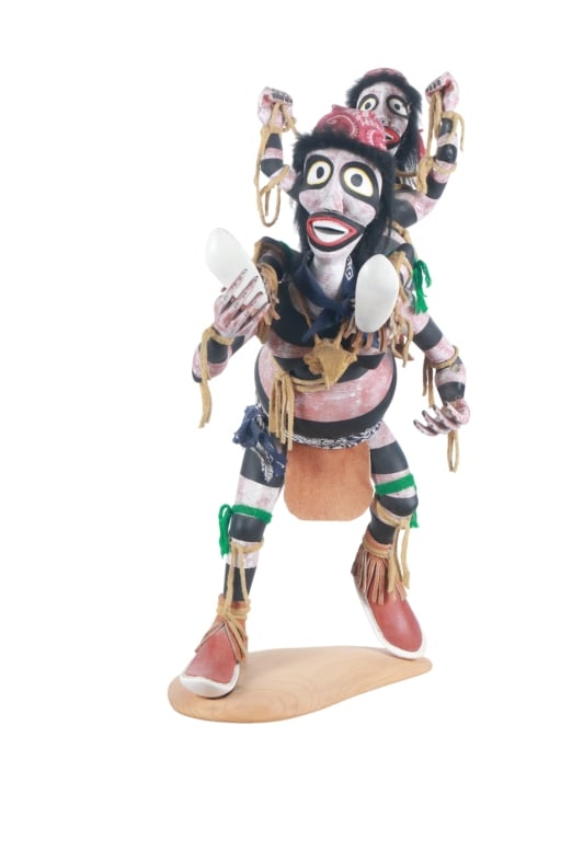 Hopi Tradition Hano Clown Piggy-Back Kachina Doll: Featured in this lot is this Hopi Tradition Hano Clown piggy-back kachina dolls circa 1960's. The Kachina doll features a humorous scene of hano clowns with the female riding the males shoulders in a 