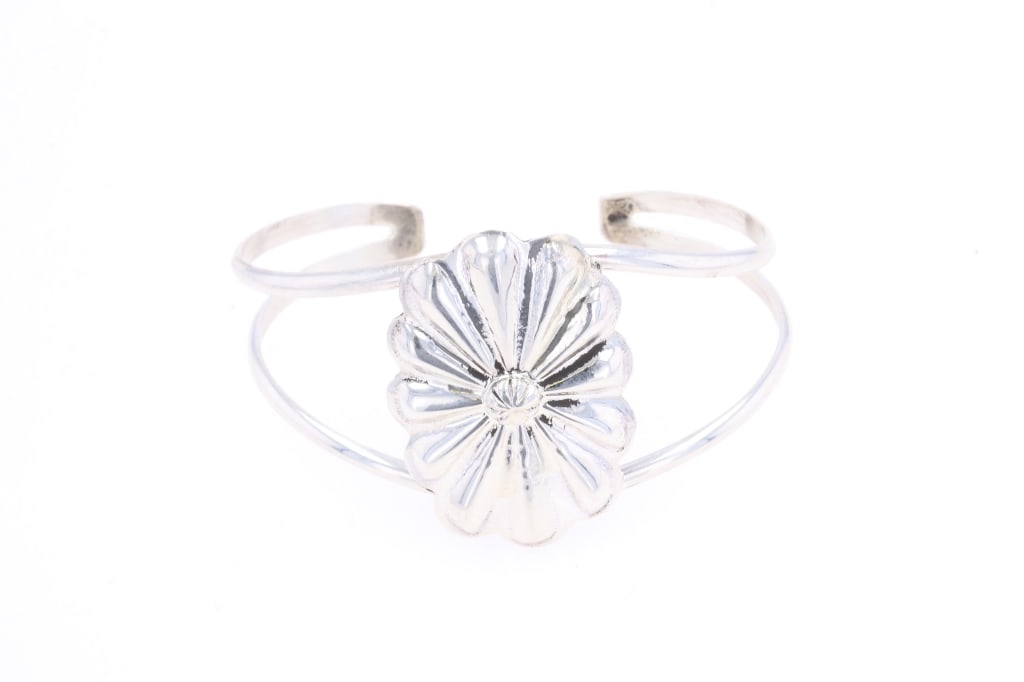 Navajo Clayton C. Tsosie Sterling Silver Bracelet: Featured in this lot is this sterling silver bracelet from Navajo artist Clayton Chez Tsosie. The bracelet features a wonderfully and professionally crafted sterling silver construction that shows a s