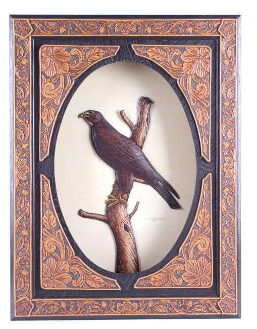 Creek/ Seminole Jonny Hawk 1938-2022 Hawk Artwork: Featured in this lot is this hawk carved artwork circa 1979 by Creek/ Seminole Indian artist Jonny Hawk born in 1938 and died in 2022. The artwork features a wonderfully and professionally crafted car