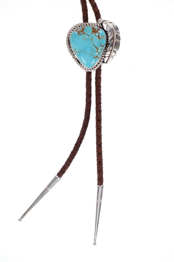 Navajo C.C. Tsosie Sterling Silver Turquoise Bolo: Featured in this lot is this sterling silver turquoise bolo tie from Navajo artist Clayton Chez Tsosie. The bolo tie features a wonderfully and professionally crafted sterling silver and Cripple Creek