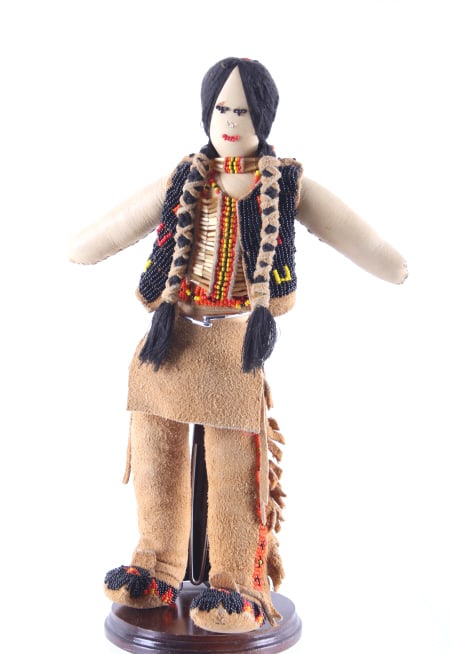 Montana Blackfoot Beaded Hide Doll c. 1960-: Featured in this lot is this Montana Blackfoot beaded hide doll circa 1960-1970. The Blackfoot doll features a wonderfully and professionally crafted hide and beaded construction that shows trade seed