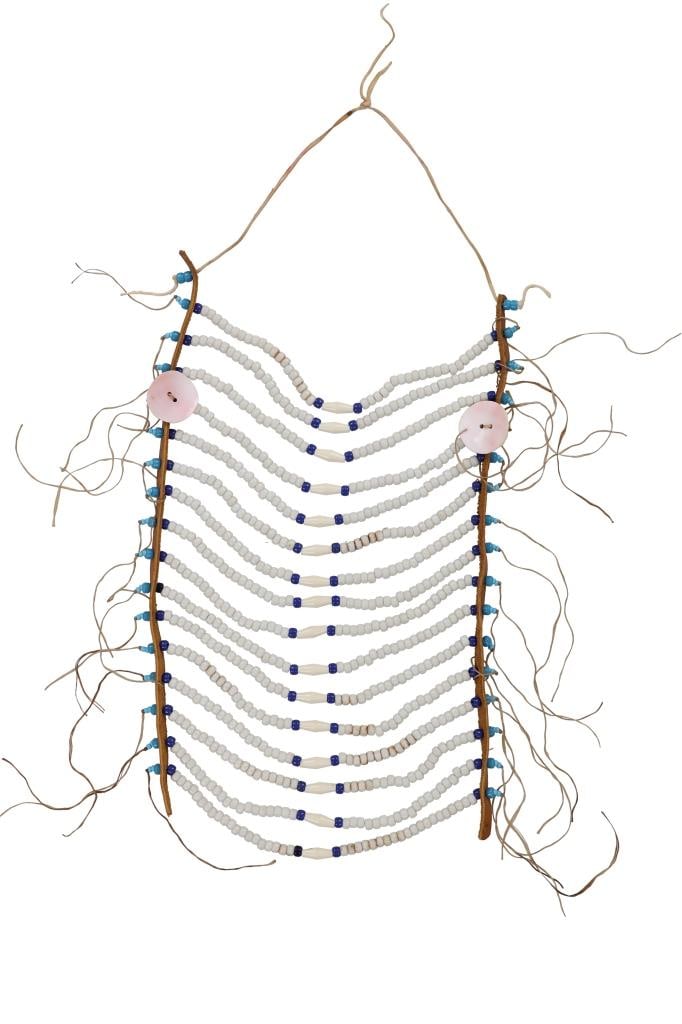 Mid-1900 Montana Crow Beaded Men's Breast Plate: The lot features a circa mid-1900's men's beaded breast plate from the Crow Apsaalooke of Montana. The piece shows leather strips with sinew like strands strung with wound glass pony beds in light blu