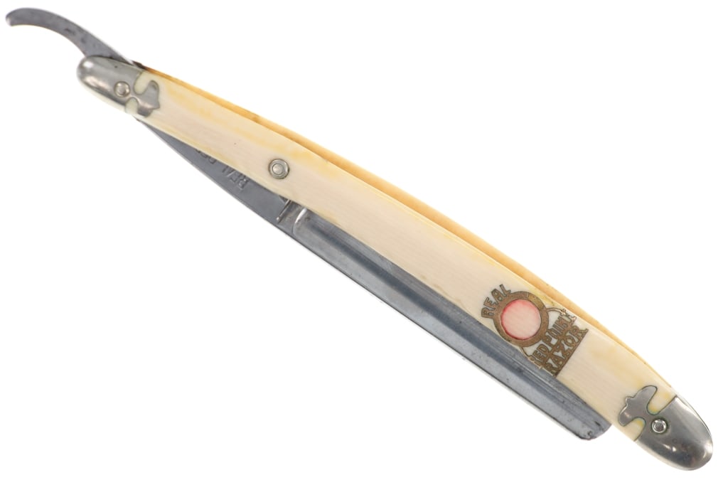 W.R. Case & Sons "Real Red Point" Straight Razor: Featured in this lot is this American, celluloid handle "Real Red Point" straight razor made by W.R. Case & Sons in Bradford, Pennsylvania in the 1950s. W.R. Case & Sons, founded in the early 1900s by