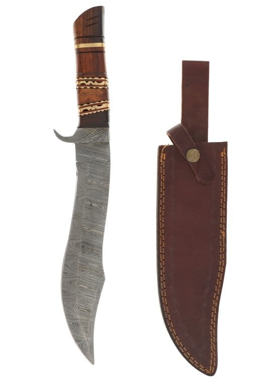 Custom Handmade Damascus Steel Kukri Knife: Featured in this lot is this custom handmade Damascus Steel Kukri knife circa 20th century. The knife features a wonderfully and professionally crafted Damascus Steel construction that shows a finger 