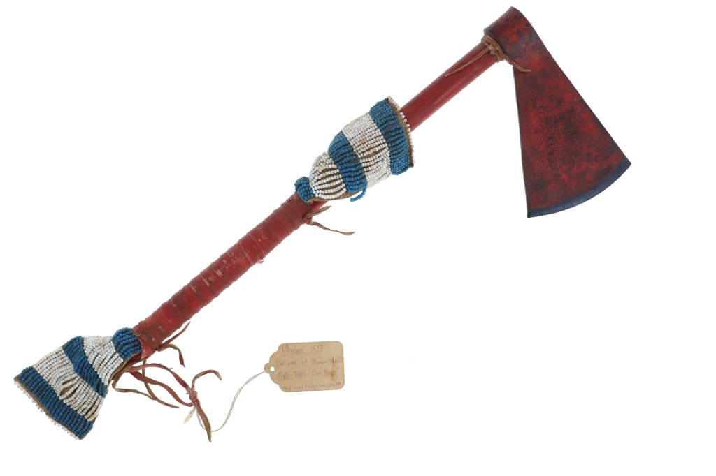 Mandan Chief Mato-Tope Tagged Pony Beaded War Club: The lot features an axe in red paint with old pony trade bead work and tag marked, "Mandan 1833 War Axe of Mandan Chief Mato-Tope 'Four Bears' Hand Forged Blade / Ash Shaft / Karl Bodmer's America- pa