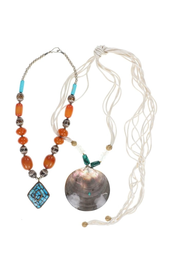 Vintage Tahitian and Moroccan Pendant Necklaces: Featured in this lot is pair of Exotic Vintage Tahitian and Moroccan Pendant Necklaces. This beautiful Moroccan pendant necklace features a wonderfully and professionally crafted construction that dis