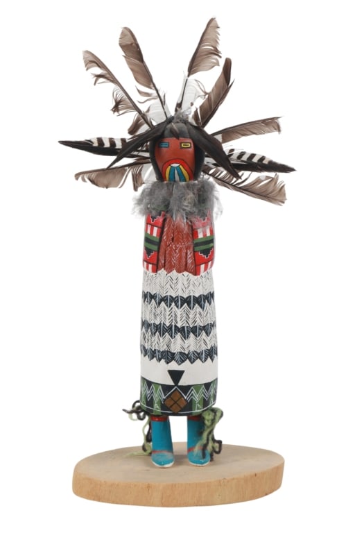Zuni Shalako Kachina or Katsina by Duane Mapatis: Featured in this lot is this Zuni Shalako Kachina or Katsina by artist Duane Mapatis circa 1983. The Kachina doll features a wonderfully and professionally crafted wood and turkey feather construction