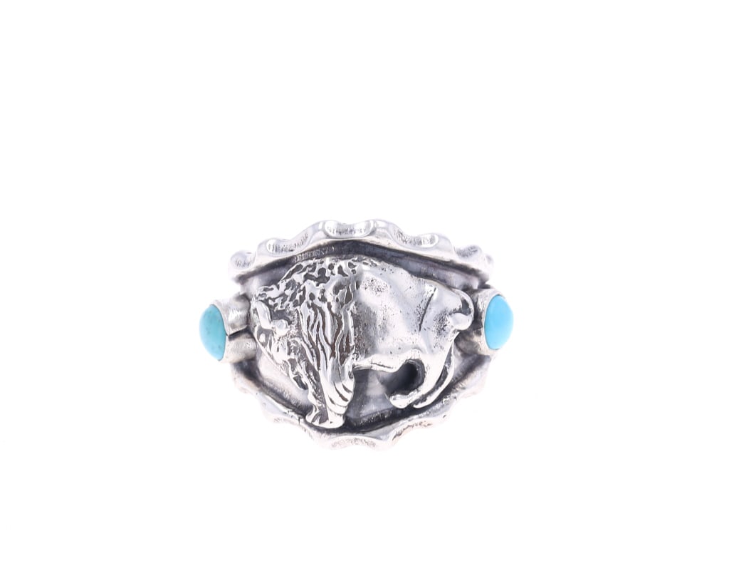Navajo Sterling Silver & Turquoise Buffalo Ring: Featured in this lot is this sterling silver and turquoise buffalo ring from Running Bear Trading Post. The ring features a wonderfully and professionally crafted sterling silver and turquoise constru