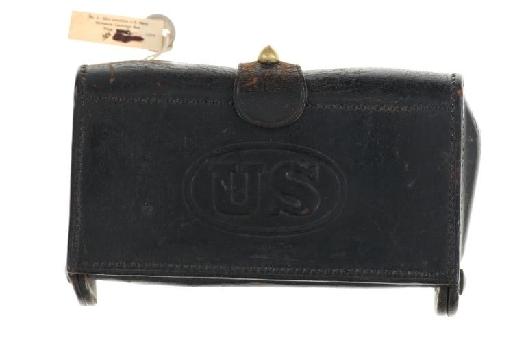 Ex-Museum USN McKeever Cartridge Case c. 1860's: Featured in this lot is this USN McKeever cartridge case circa 1860's. Provenance: From Garth's Civil War Museum (See Tag). The case is made from leather with a brass hinge rod and clasp. The front of