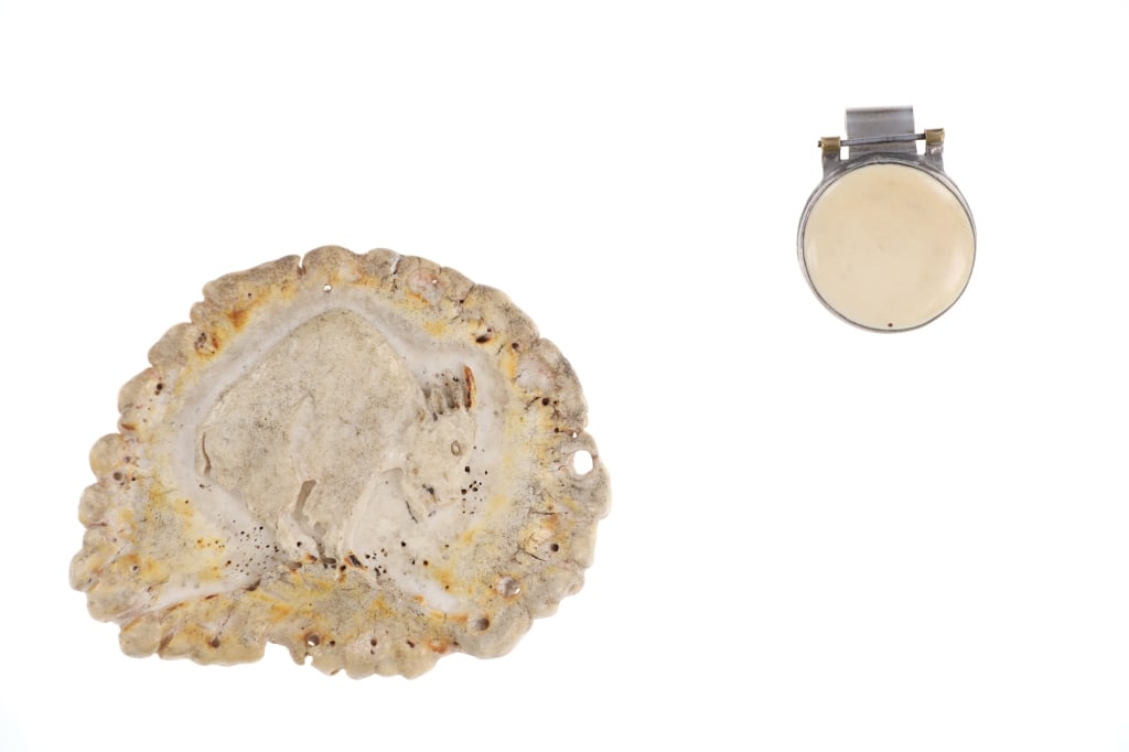 20th C. Zuni Elk Antler Burr Buckle & Bone FOB: Featured in this lot is this Zuni elk antler burr buckle and silver/ bone key FOB circa 20th century. The buckle features a carved mountain goat into a elk antler burr and made into a belt buckle; the