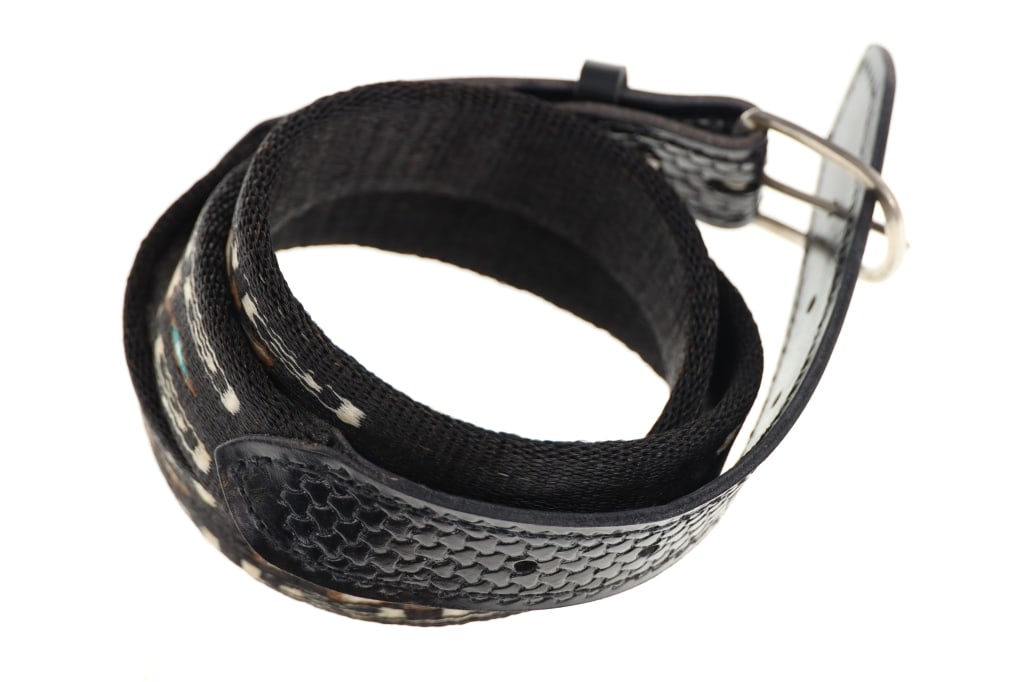 Deer Lodge, MT Prison Hitched Horsehair Belt: Featured in this lot is this Deer Lodge, Montana prison hitched horsehair belt. The belt features a wonderfully and professionally crafted hitched horse hair and leather construction that shows a Nati