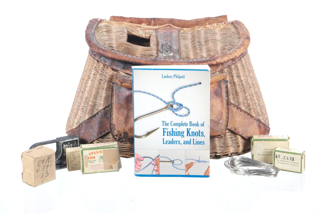 Ca. 1950's Montana Wicker Creel & Fly Fishing Book: Featured in this lot is this collection of Montana wicker creel and fly fishing accoutrements circa 1950's. The collection includes a Montana creel circa 1950's with straps intact and includes a copy 