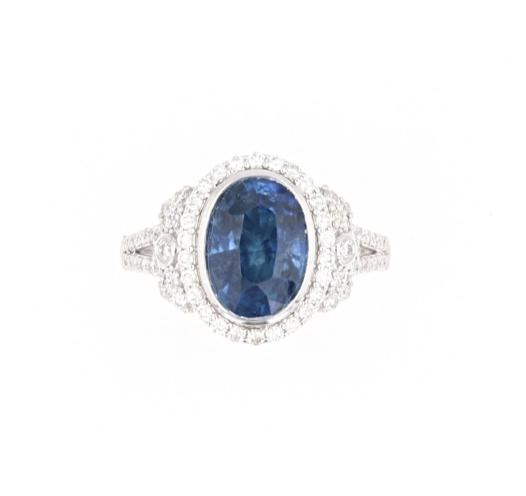 Fine Designer Blue Sapphire GIA Certified Ring: This is a fine Oscar Friedman designer platinum ring set with a GIA Certified 4.36 carat natural Sapphire with rich blue color set with VS1 natural diamonds. The ring is signed Oscar Friedman PT900 fo