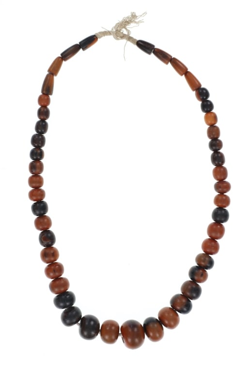 EXOTIC Polished Water Buffalo Horn Trade Necklace: Featured in this lot is this exotic polished water buffalo horn trade necklace. The necklace features a wonderfully and professionally crafted polished water buffalo horn construction that shows a gra