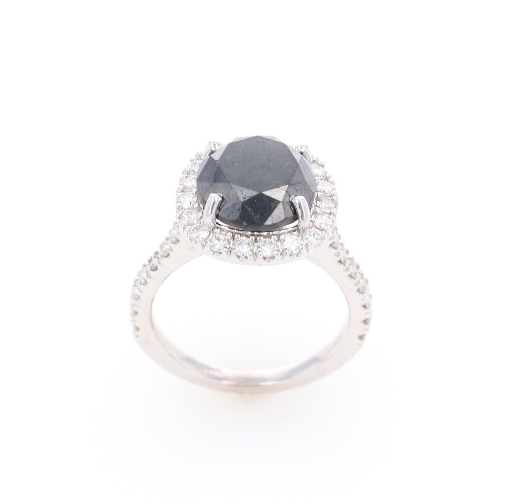 Fancy Black & White Diamond 14k White Gold Ring: Featured in this lot is this fancy black and white diamond 14k white gold ring with GGA paperwork. The ring features a polished, stamped, and tested 14k white gold construction that is marked on the u