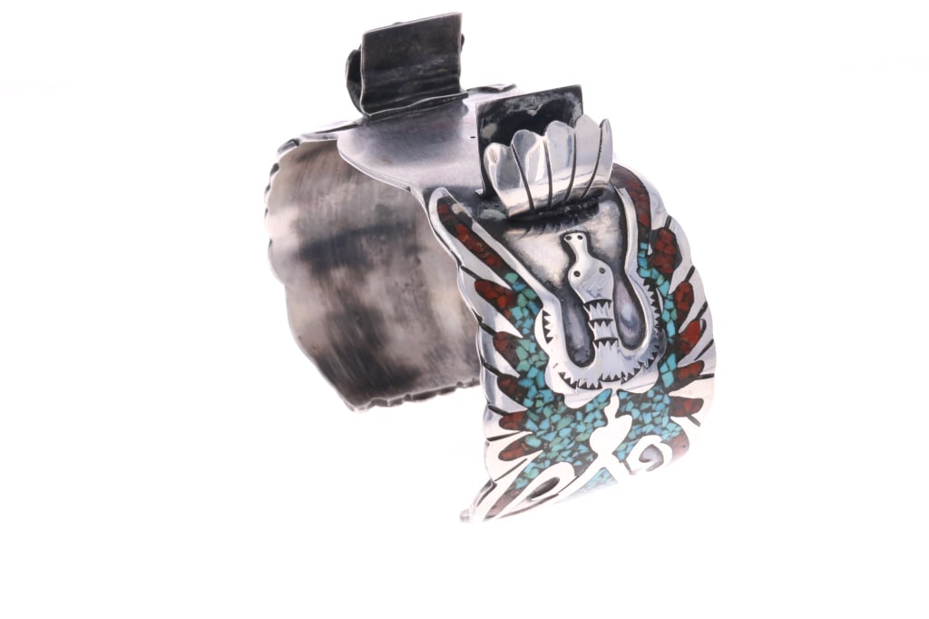 Vintage Pawn Zuni Chip Turquoise & Coral Cuff 1970: The lot features a fantastic vintage pawn chip inlaid turquoise and coral sterling silver watch cuff bracelet from circa 1970?s. The bracelet shows a peyote water bird design running down both sides i