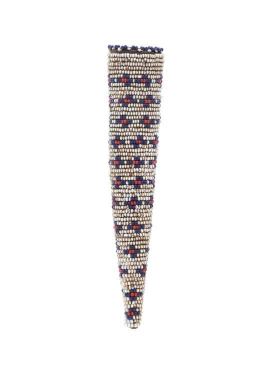 1930's Kiowa Beaded Awl Belt Case: The lot features a circa 1930's beaded awl belt case from the Kiowa of the Southern Plains. The piece shows a thick leather cone shape covered in glass trade seed beads showing a cross pattern showing