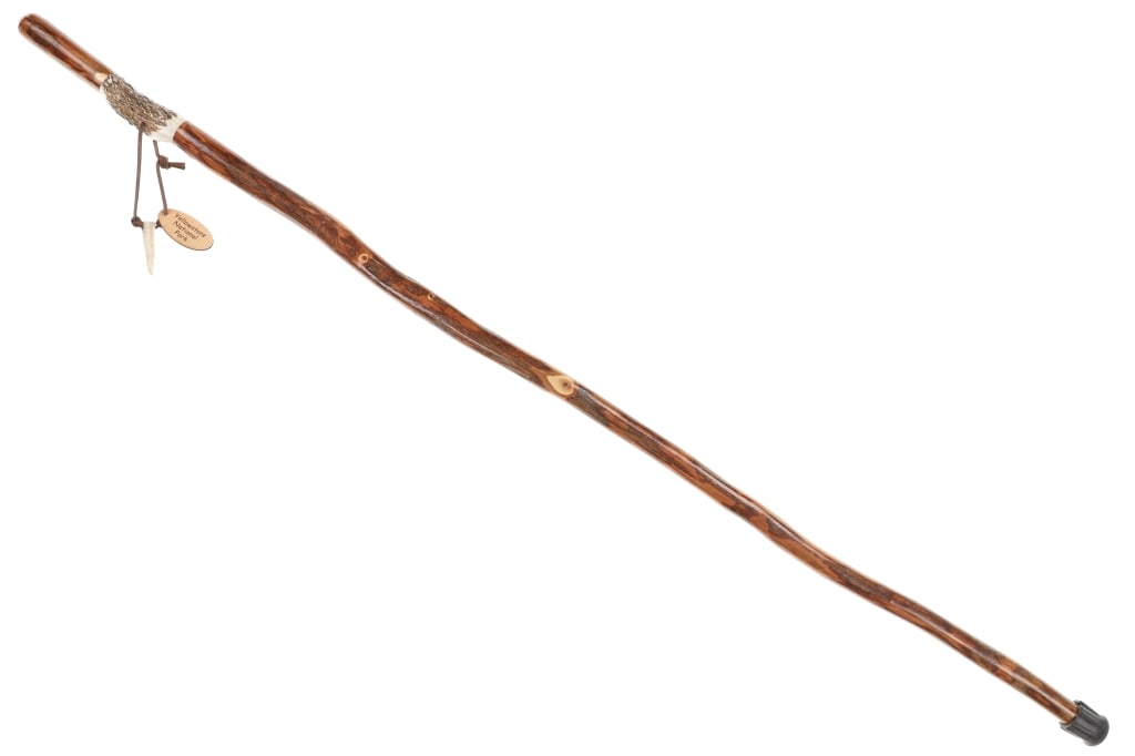 Carved Wood & Antler Yellowstone Walking Sticks: Featured in this lot is this Yellowstone National Park carved wood & antler walking stick from the 20th century. This walking stick features a professionally carved wood construction with an antler ha