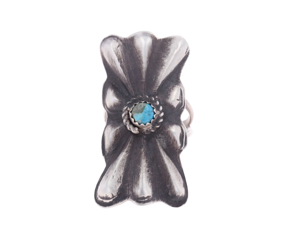 Navajo CC Tsosie Sterling Silver Turquoise Ring: Featured in this lot is this sterling silver turquoise ring from Navajo artist Clayton Chez Tsosie. The ring features a wonderfully and professionally crafted sterling silver and Bisbee turquoise cons