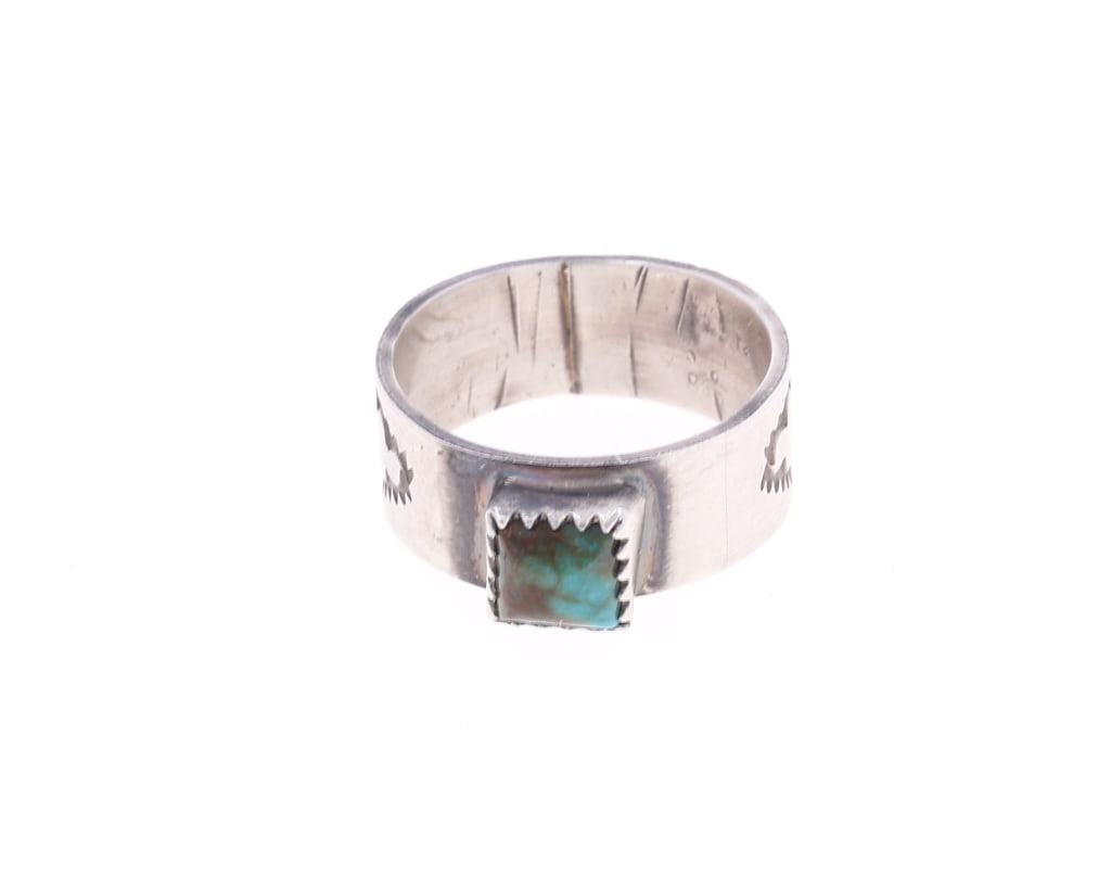 Navajo Sterling Silver Bisbee Turquoise Ring: Featured in this lot is this Navajo sterling silver and turquoise ring. The ring features a wonderfully and professionally crafted sterling silver construction that shows stamping to the band and show