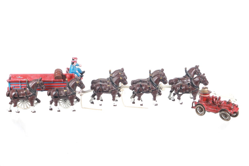 Cast Iron Children's Floor Toys 1940-1950s (2): For your consideration are two, early cast iron floor toys, a fire truck and beer wagon with horses. The fire truck shows a split style construction, held together with a pin near the center of the tr