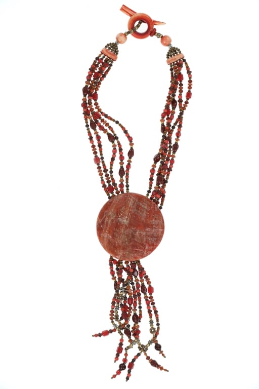 Vintage Santo Domingo Pueblo Mutli-Stone Necklace: The lot features a fantastic Santo Domingo Vintage shell and multi-stone necklace from the mid-to-late 1900?s. This strand necklace features a beautiful abalone shell main pendant, showing the exterio