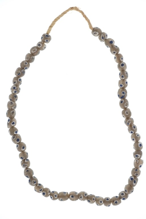 Antique Roman "Eye" Powdered Glass Trade Beads: Featured in this lot is this Roman "Eye" powdered glass trade bead necklace. The necklace features a wonderfully and professionally crafted powdered glass construction that shows the traditional Roman