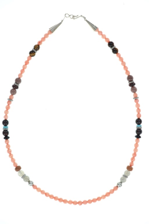 Navajo Sterling Silver Multi Stone Beaded Necklace: Featured in this lot is this Navajo sterling silver multi stone beaded necklace. The necklace is wonderfully and professionally crafted sterling silver, pink conch, tiger eye, turquoise, and moonstone