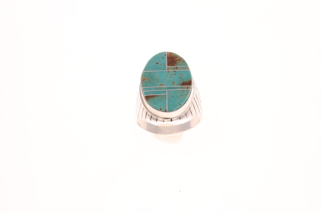 Navajo Wilbert Grey Cripple Creek Turquoise Ring: Featured in this lot is this sterling silver cripple creek turquoise ring from Navajo artist Wilber Grey. The ring features a wonderfully and professionally crafted sterling silver and inlaid cripple 