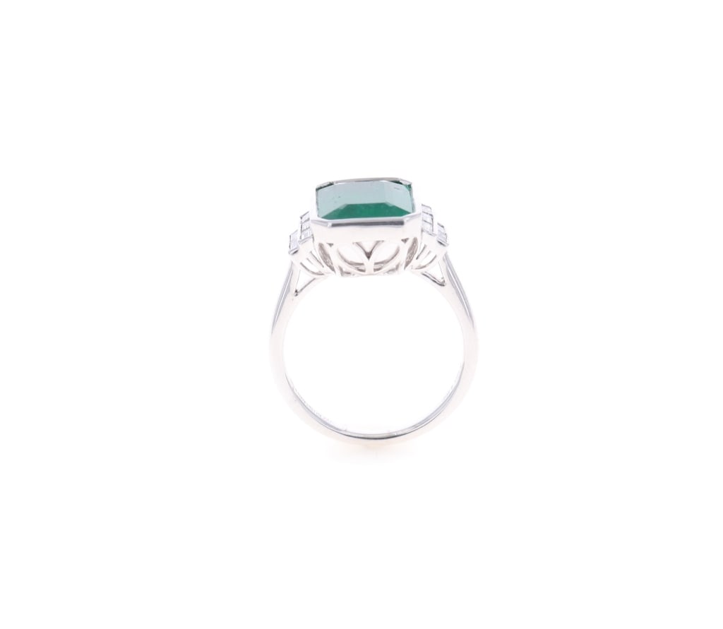 4.26ct Emerald VS2 Diamond Platinum Ring: Featured in this lot is this 4.26ct emerald VS2 diamond platinum ring with GGA paperwork. The ring is polished, stamped, and tested platinum construction that is marked Oscar Freidman. The center ston