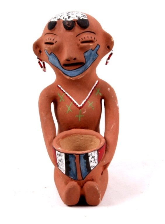 Southwestern Pottery Sculpture 1960's: This is hand made by a Native American located in the Southwest. This shows glass trade bead earrings, hand formed body, and painted designs. This measures 6.5" tall and 3" wide.