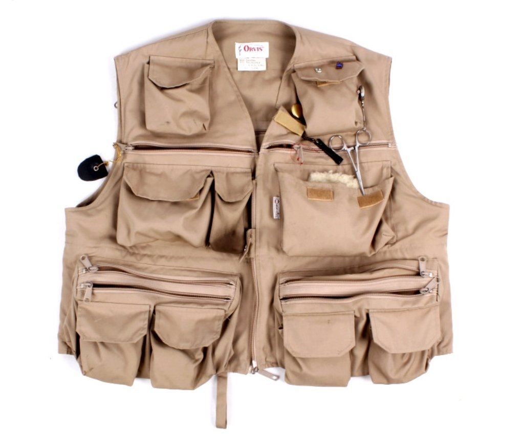Orvis Fishing Vest: This tan fishing vest is by the iconic fly-fishing company, Orvis. Features tons of outer pockets--zippered, buttoned, etc--for gear. Also includes great inner storage pockets and two patches on the b