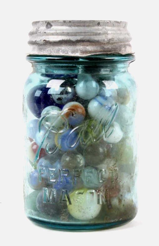 Antique Blue Glass Jar & Marbles: This lot features a jar full of marbles ranging in size, age, and what they are made of. These are in a blue glass jar with a metal lid. Jar measures 5 3/8" tall and 3 1/8" diameter.