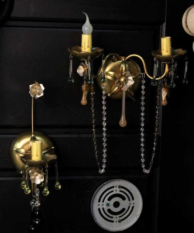 Schonbek Rare Light Fixtures: This lot features 2 "One of a Kind" wall lights with hand made glass pieces. These have a floral design and are brand new designer lights. The larger measures 10 5/8" wide and 14.5" tall.