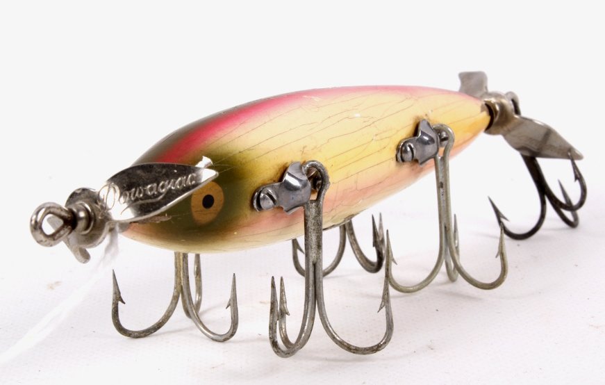 Heddon Dowagiac #150 5 Hook Minnow: This is a rare early 1900's Heddon Dowagiac with the five hooks. The lure is highly collectible and is overall a great piece. Measures approximately 6" long to end of hook.