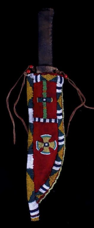 Montana Crow Beaded Sheath & Knife circa 1880-1890: The lot features a trade knife with rawhide wrapped handle and beaded beaded sheath hand made by the Montana Crow Native American. This early piece (believed to be 1880-1890) features a rawhide sheath