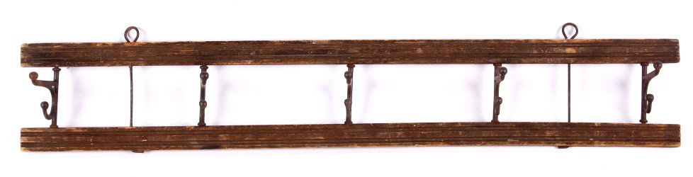 Antique Wood & Iron Coat Hanger.: This antique hanger is made of iron and wood craftsmanship. The hanger would be a great finishing point in any home. Measures 24.5" in length and 4" in height.