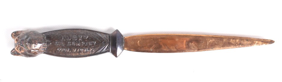 Husky Gas & Oil Cody Wyoming Copper Letter Opener: This is a Art Deco style solid copper letter opener from Husky Gas & Oil in Cody, Wyoming. The letter opener features the Husky Oil Mascot and is also marked. Measures 9" long and 1" wide.