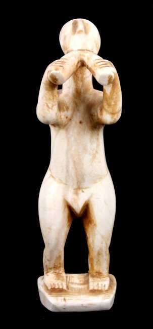 Antique Marble Sculpture: This is an original hand carved sculpture using a marble base. This unique piece shows the shape of what looks to be an early native figure. Measures 8" tall. The age and exact origins are unknown, bu