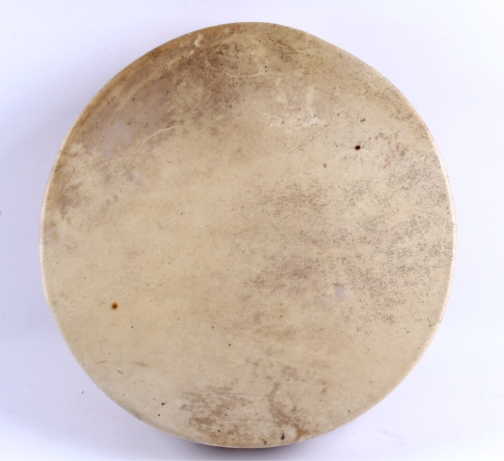 Native American Rawhide Drum This lot is a Norther: This lot is a Northern Plains Native American Rawhide drum. This drum is made of a solid wood frame and the drum and straps are completely rawhide. The piece has great sound and color. Measures 14.75"
