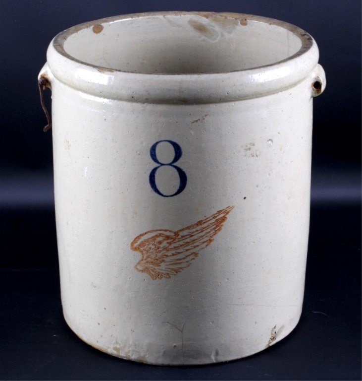 8 Gallon Red Wing Crock This lot features an 8 gal: This lot features an 8 gallon Red Wing crock. The crock is in good condition with several cracks along the bottom and front. In addition, the wire handles are missing. The crock measures 13.75" in dia