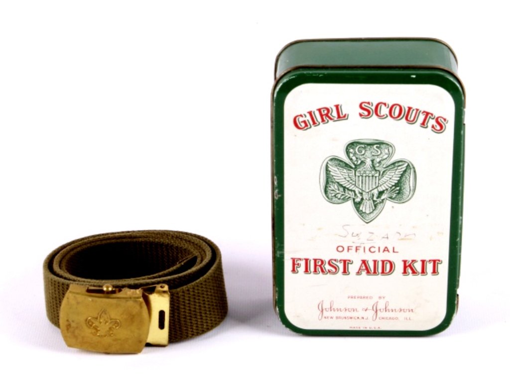 Girl Scout First Aid Kit and Boy Scout Belt This l: This lot includes a Girl Scout first aid kit and a Boy Scout belt. Both are in very good condition. The first aid kit measures 4" x 6" and the belt is 40" long.